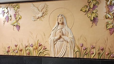 In the image the iran metro station is shown with Mary in the wall showcasing christianity
