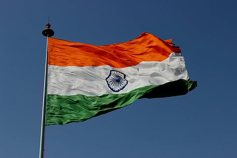 In the image indian flag is shown hoisted in the air