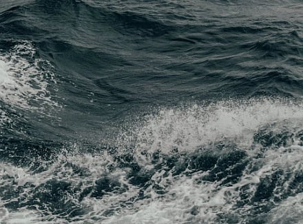 Image of deep waters and strong waves in grayscale  photography style.