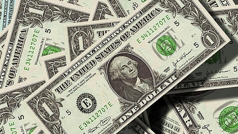 In the image dollar notes are shown