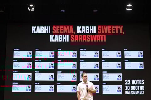Image of Congress leader Rahul Gandhi at a press conference AICC headquarters in New Delhi. At the background, the text reads 'Kabhi Seema akbhi sweety  kabhi saraswati'