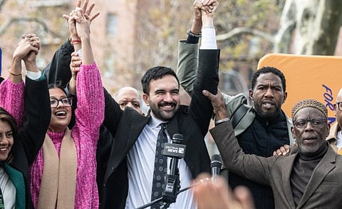 In the image Zohran Mamdani is shown celebrating his win in NYC Mayorial election