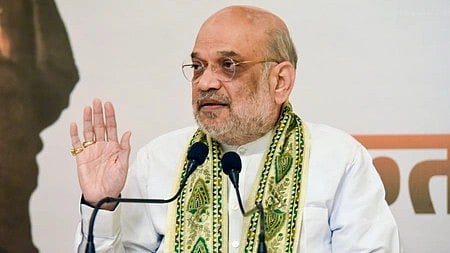 Amit Shah speaking at a campaign rally in Bihar, gesturing to voters and emphasising the need to prevent ‘jungle raj’ with their vote.