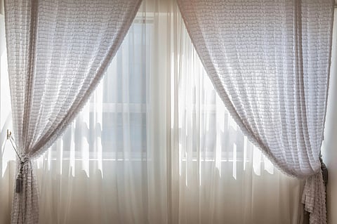 In the image white curtains are shown 