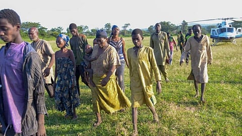 In the image Nigerian army is shown. walking in a green land