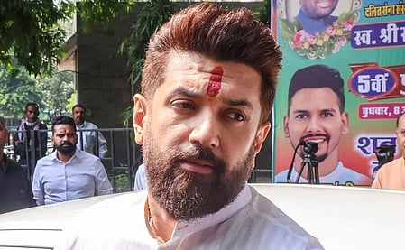 In the image Chirag Paswan is shown in a campaign rally