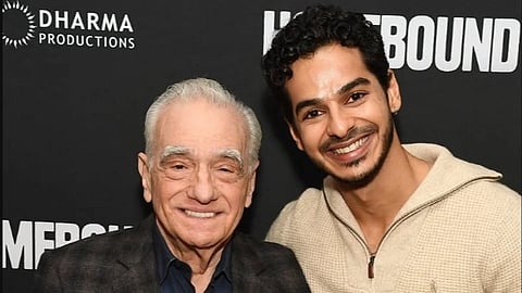 Image of legendary director producer Martin Scorsese with the homebound star Ishan Khatter on his left at the film's screening. The background includes the text of Dharma production and the title of the film Homebound