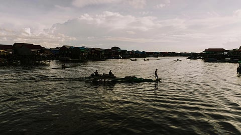 People on Boat on River in Village, Kampong Khleang, Siem Reap Province, Cambodia