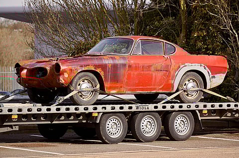 A Red Coupe on Flatbed Trailer