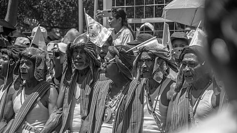 A group of men in traditional attire with cloth headdresses and sashes stand together. They appear to be engaged in a cultural event. The black-and-white photo captures a sense of pride and unity. (Representational image)