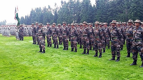 Indian army troops, with the 6th Battalion of the Kumaon Regiment, stand together during the opening ceremony of Yudh Abhyas 15 at Joint Base Lewis-McChord, Wash., Sept. 9, 2015.