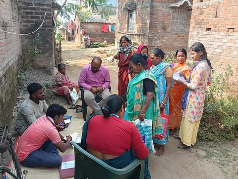 Election officers reviewing Electoral Forms in rural West Bengal.