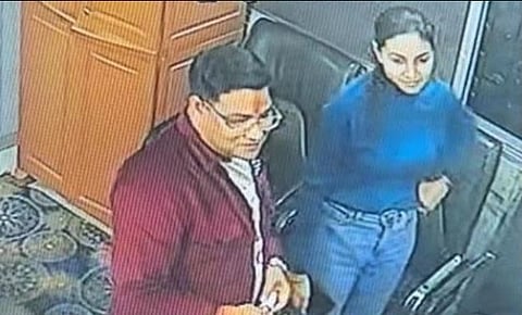 Deepak Tandon and Kalpana Verma stand together; screenshot from CCTV footage.