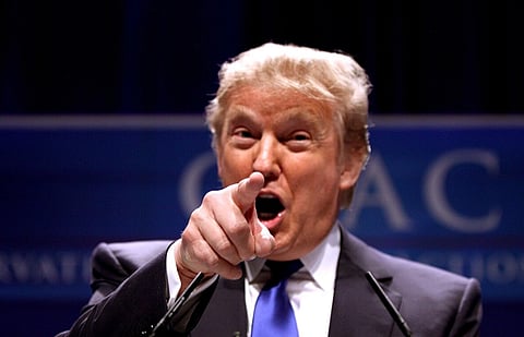 Image of President Donald trump pointing his finger towards the camera. He is speaking at CPAC 2011 in Washington, D.C.