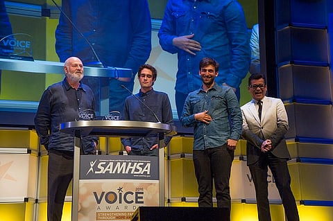 The photo shows Rob Reiner, Nick Reiner, Matt Elisofon, and Johnson Chan accepting their SAMHSA Special Recognition Award and a 2016 Voice Award for their film Being Charlie.