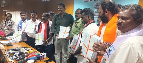 Booth Level Agents pose with draft electoral rolls in hand at a press conference in Puducherry.
