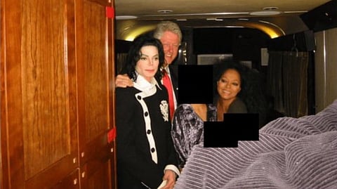 In the image Bill Clinton is shown with Michael Jackson in a room three faces are blacked out the setting looks like a room