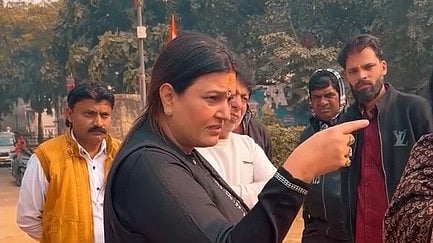 A screenshot from a video uploaded to social media by BJP Councillor Rebu Chaudhary, in which she is pointing a finger at someone.