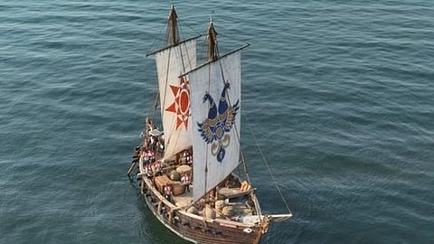Wooden sailing ship with intricate symbols on sails, sailing on calm, vast ocean. The scene conveys a sense of adventure and tranquility.