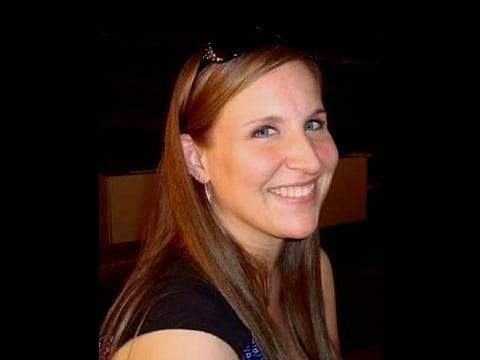 Brooke Shoemaker posing for a photo with flash.