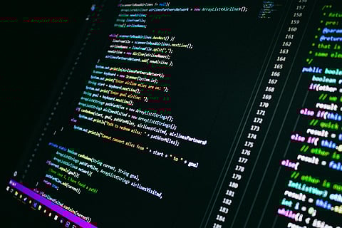 Close-up of multicolored Java code on a dark screen, featuring highlighted syntax and line numbers.
