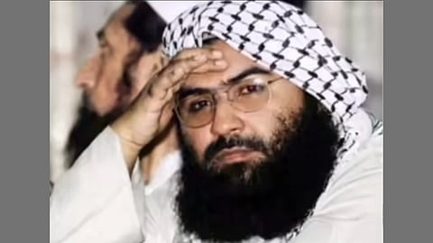 In the image Jaish-e-Mohammed chief Masood Azhar is shown his hand is on his head and behind him is another muslim man