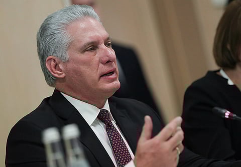 Cuba's President Miguel Díaz-Canel Bermúdez in a meeting, wearing formals, speaking to somebody