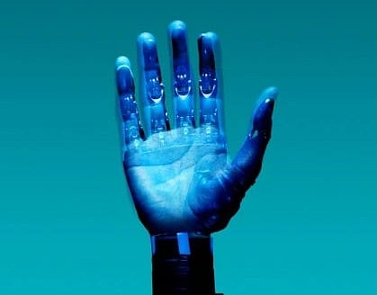 A robotic hand is depicted against a blue background, with a metallic and futuristic design, conveying a sense of advanced technology and innovation.
