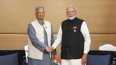 In the image Bangladesh Advisor Md. Yunus is shown shaking hands with PM Modi