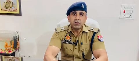 A screengrab of a video conference of ASP Anuj Chaudhary, in his uniform.