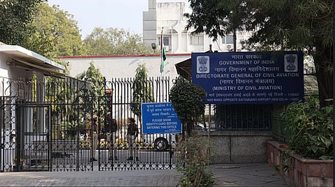 The front gate of the DGCA building, its office behind it