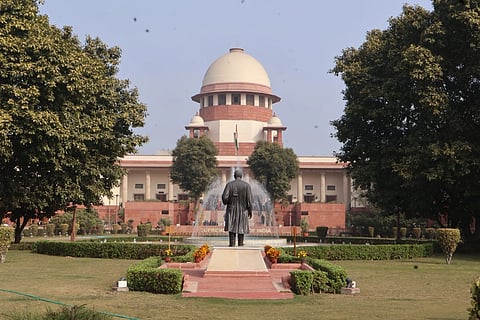 The Supreme Court of India, a statue of a lawyer at its front