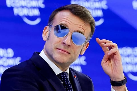 Image of French President Emmanuel Macron wearing blue reflective aviator sunglasses at the  World Economic Forum at Davos Switzerland.