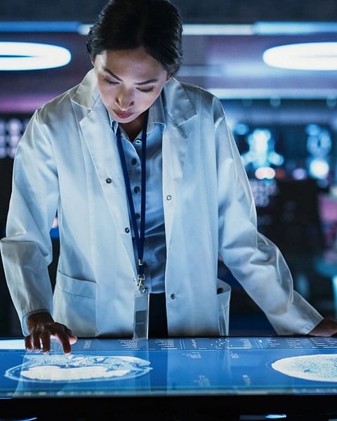 A female scientist working at a computer