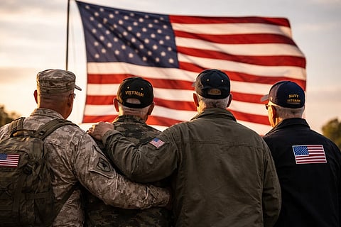 Four US Veterans looking at the US Flag