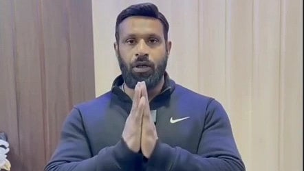Deepak Kumar stands with folded hands in screenshot from a social media video