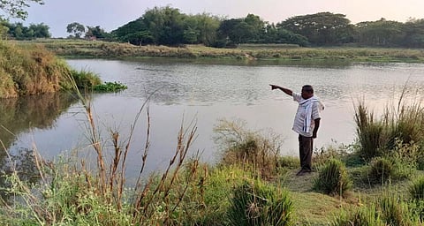 Social activist Kishan Patnaik showing the place where Gangua nullah joins with Daya river in Kanti village