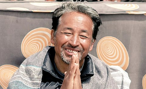 Sonam Wangchuk smiles with folded hands.