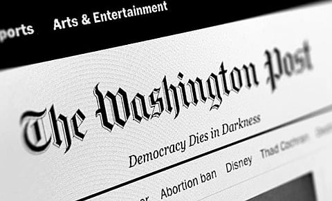 Front page of The Washington Post website, featuring its gothic masthead and slogan "Democracy Dies in Darkness," with a navigation bar below.