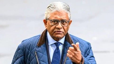 In the image Vikas Nath  is shown with white hair winter clothes looking at the camera
