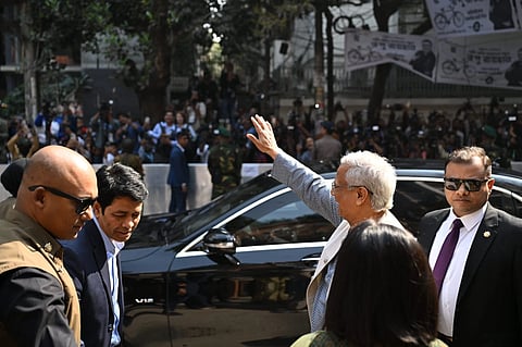 Md Yunus waiving his hand to the public after casting his vote