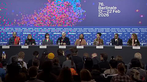 Jury panel at the Berlin International Film Festival 2026 facing reporters in front of a coloured backdrop