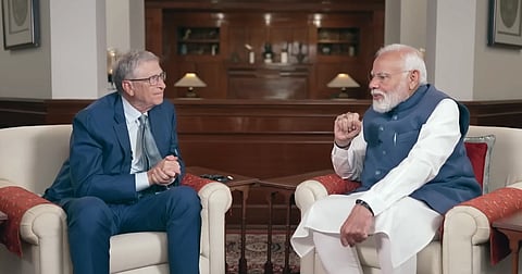 Bill Gates and PM Modi sitting in sofas, talking about AI and development