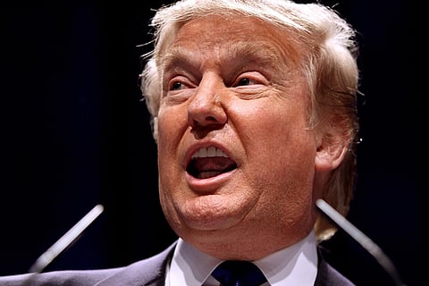 Close up shot of Donald Trump speaking at CPAC 2011 in Washington, D.C. The background of the image is black 