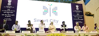 The Prime Minister, Shri Narendra Modi unveiling the Logo of Smart Cities Mission, at the launch of the Smart Cities Mission, Atal Mission for Rejuvenation and Urban Transformation (AMRUT) and Housing for All Mission, in New Delhi on June 25, 2015. 