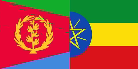 overlapping flads of Eritrea (left) and Ethiopia (right).