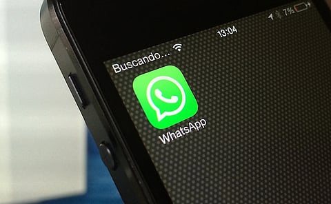 Close up of the WhatsApp icon on a phone.