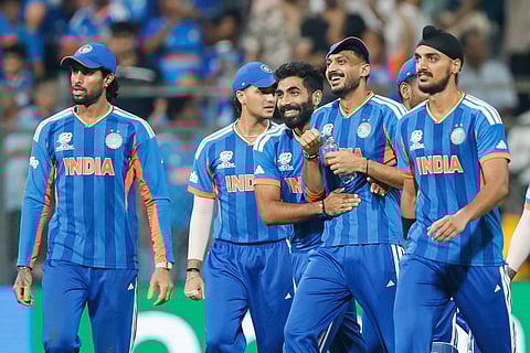 Indian players Arshdeep Singh, Jasprit Bumrah, Axar Patel and others celebrating a wicket. 