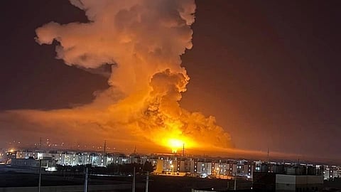 An explosion and a plume of smoke