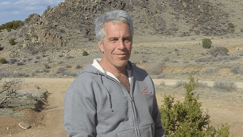 In the image jeffery epstein is shown wearing casual clothes in an open deserted area
